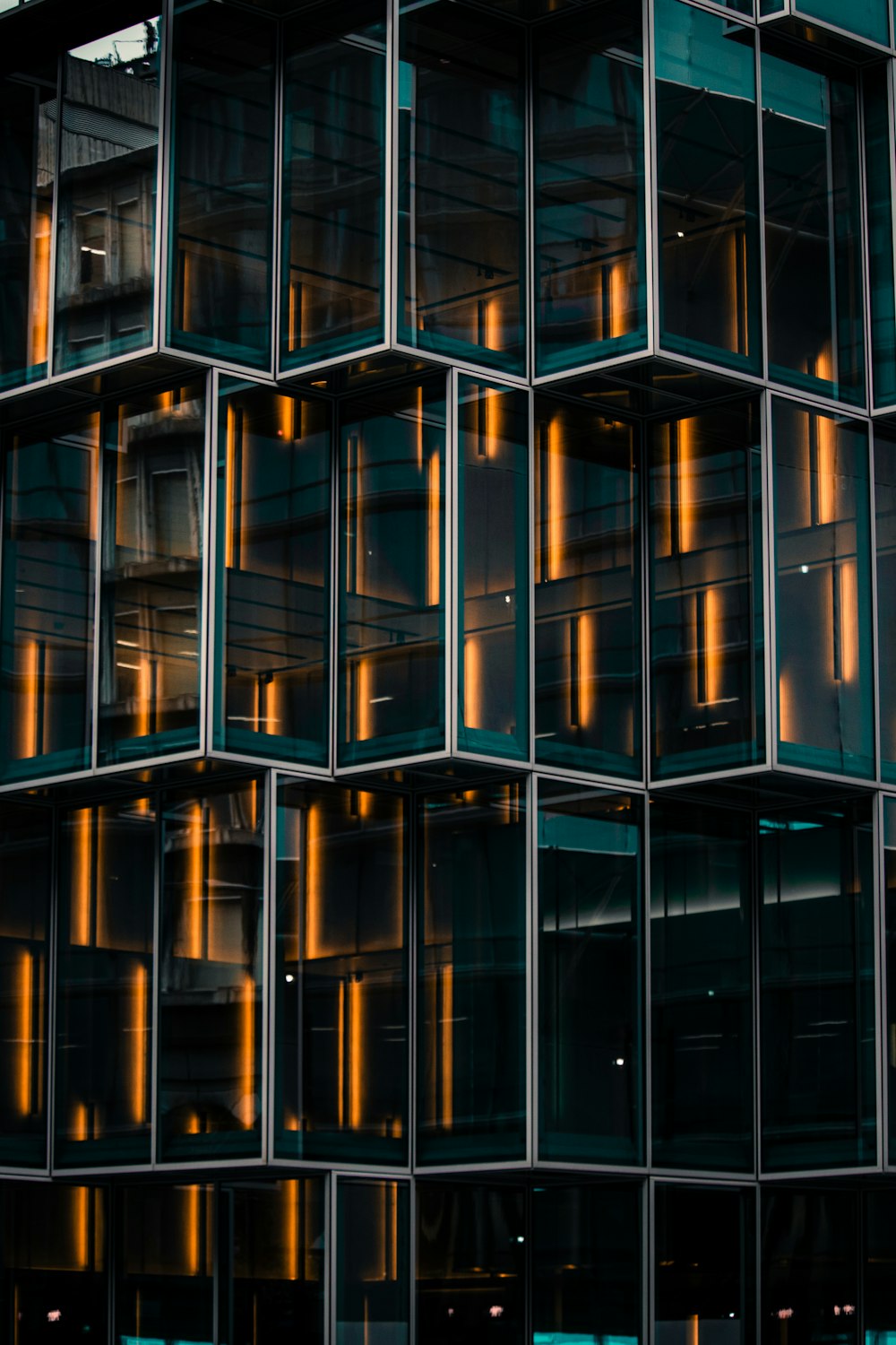 a tall building with lots of windows next to a street