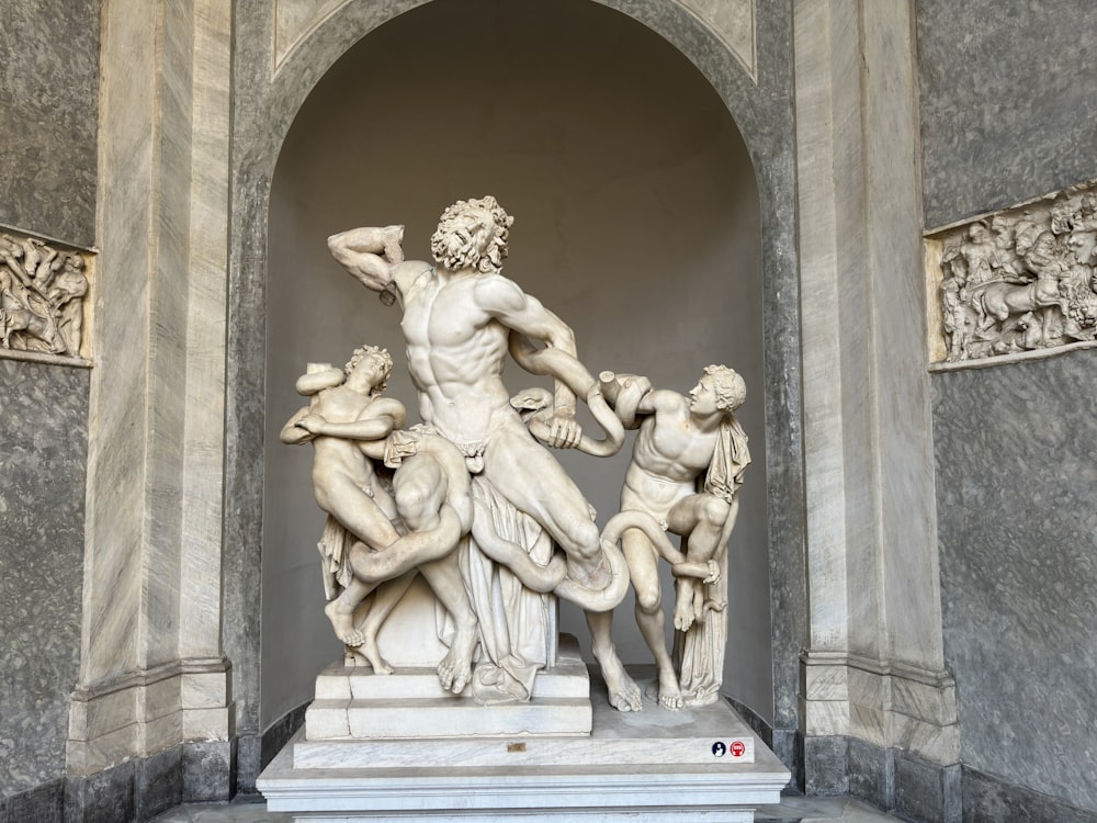 a statue of a man surrounded by other statues