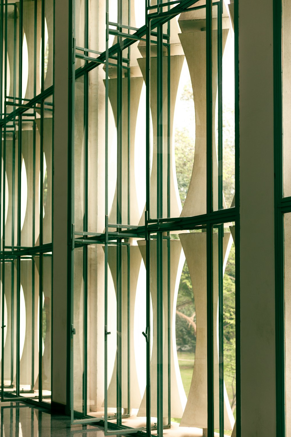 a room with a bunch of windows and a clock on the wall