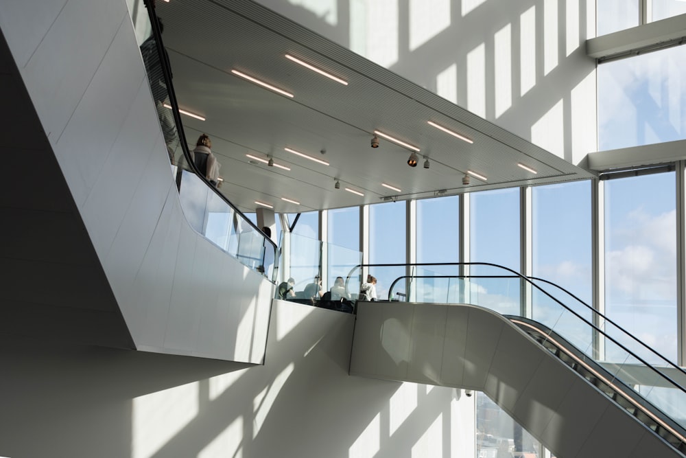 a group of people walking up and down some stairs