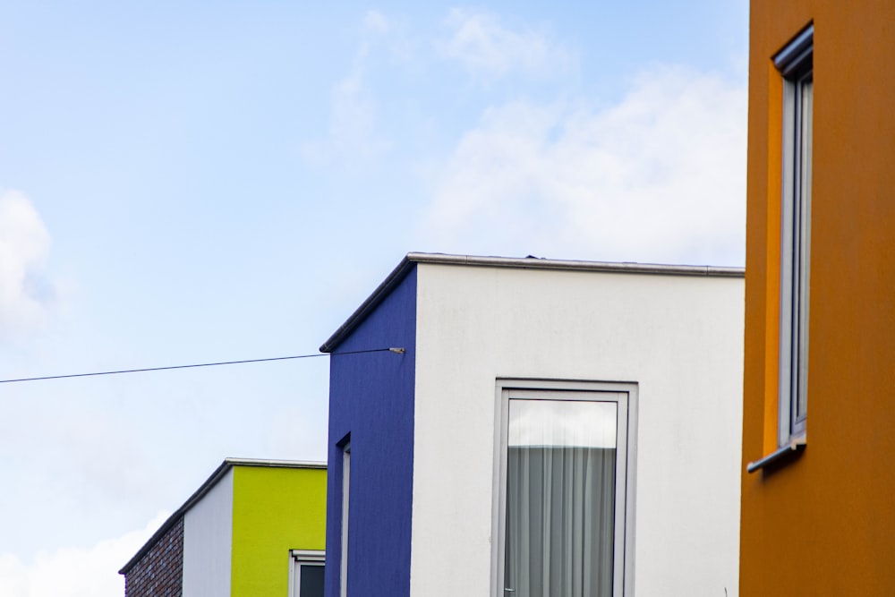 a row of multicolored buildings next to each other