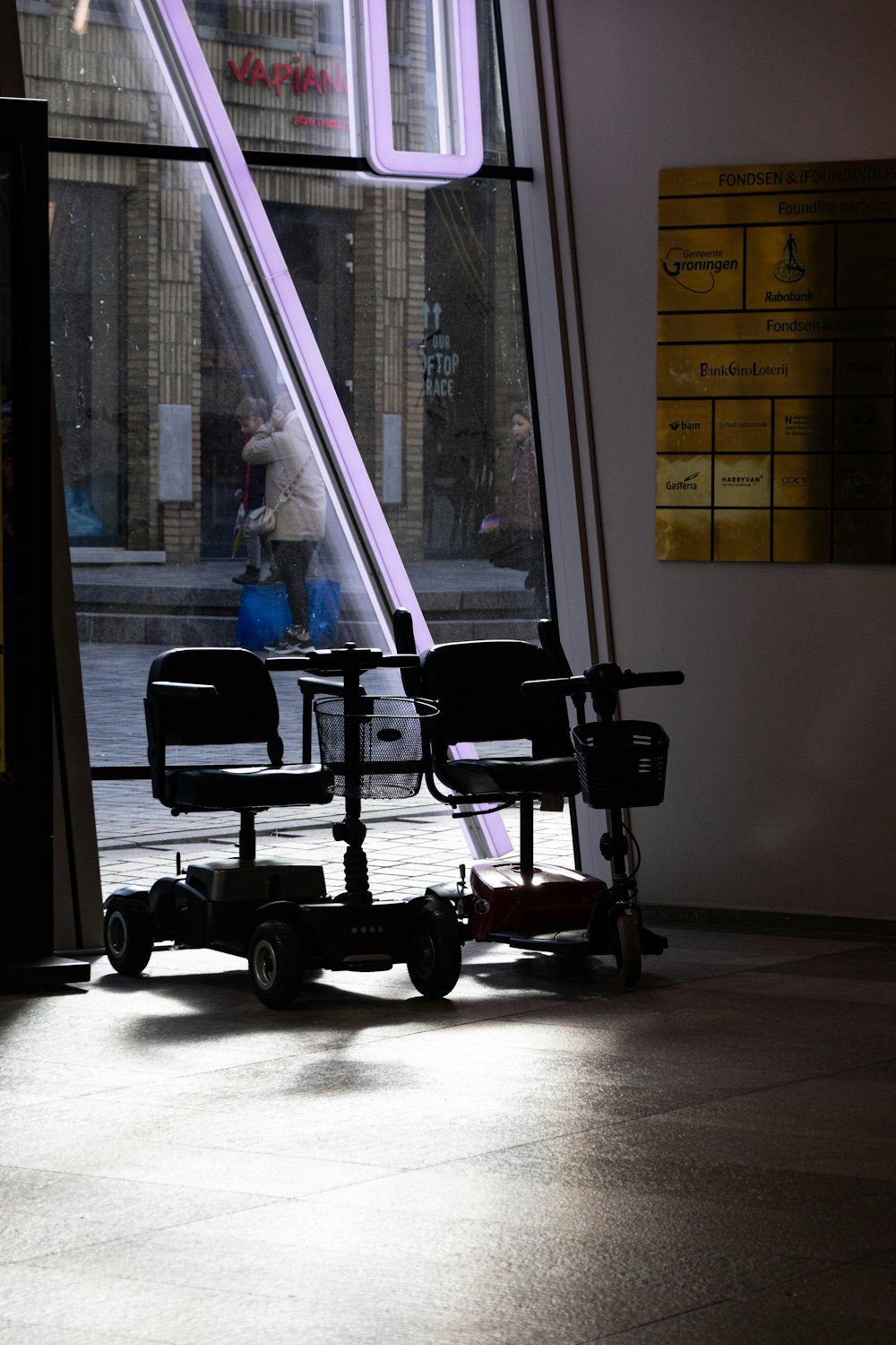 a couple of chairs sitting in front of a window