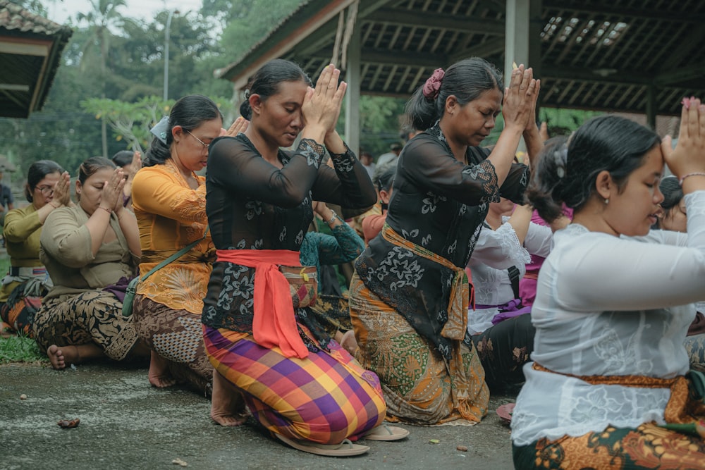 a group of women sitting next to each other