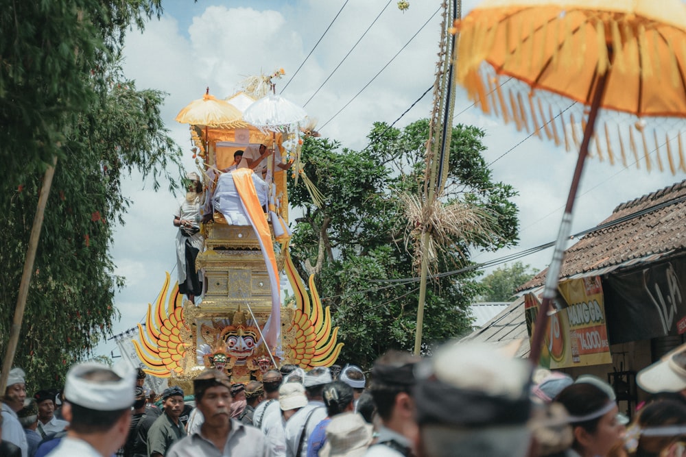 a group of people standing around a float