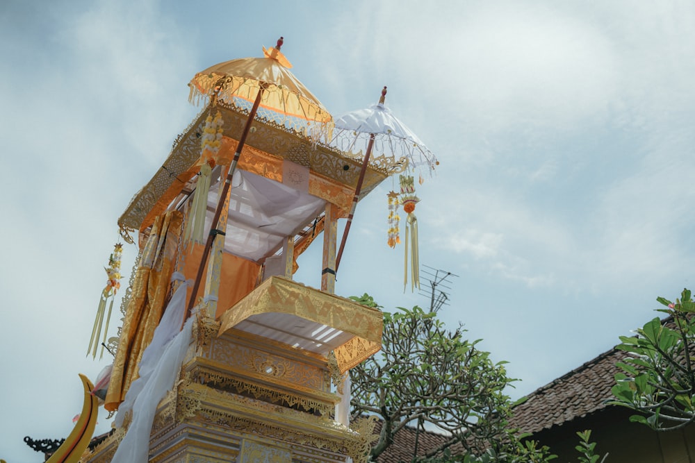 a tall tower with an umbrella on top of it