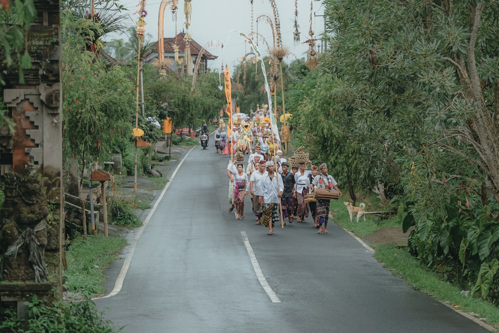 a group of people walking down a street