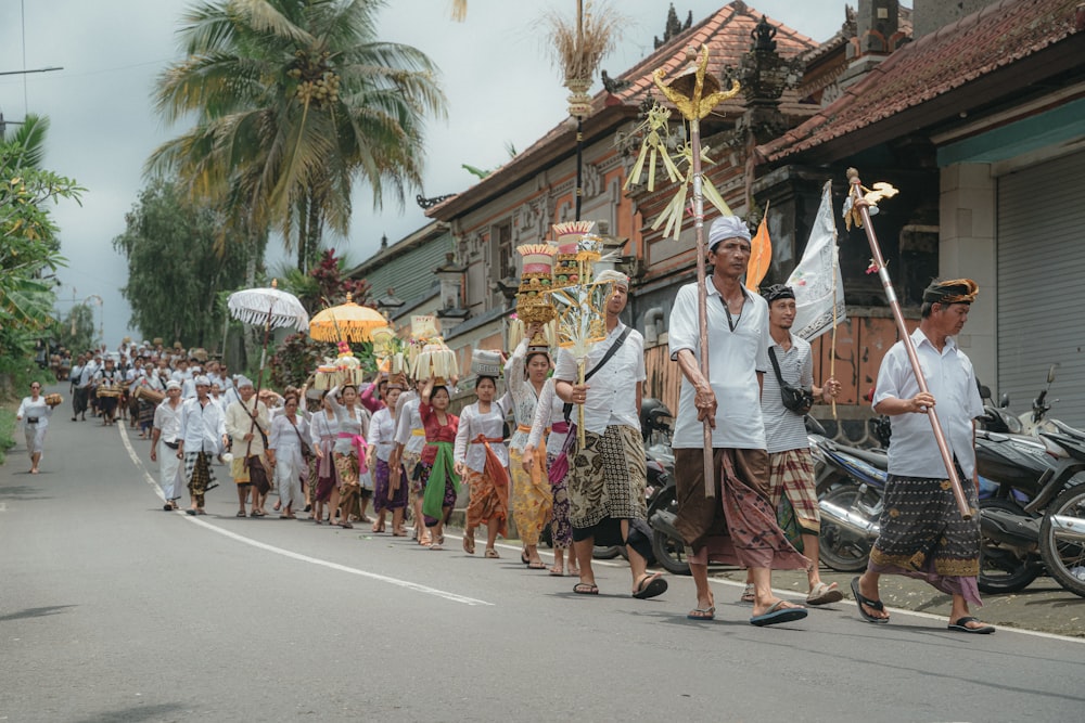 a group of people walking down a street