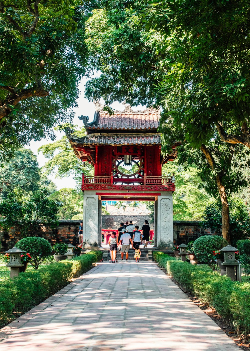 a group of people that are standing in front of a gate