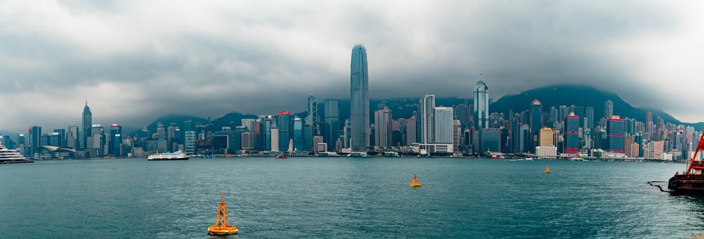 a large body of water with a city in the background