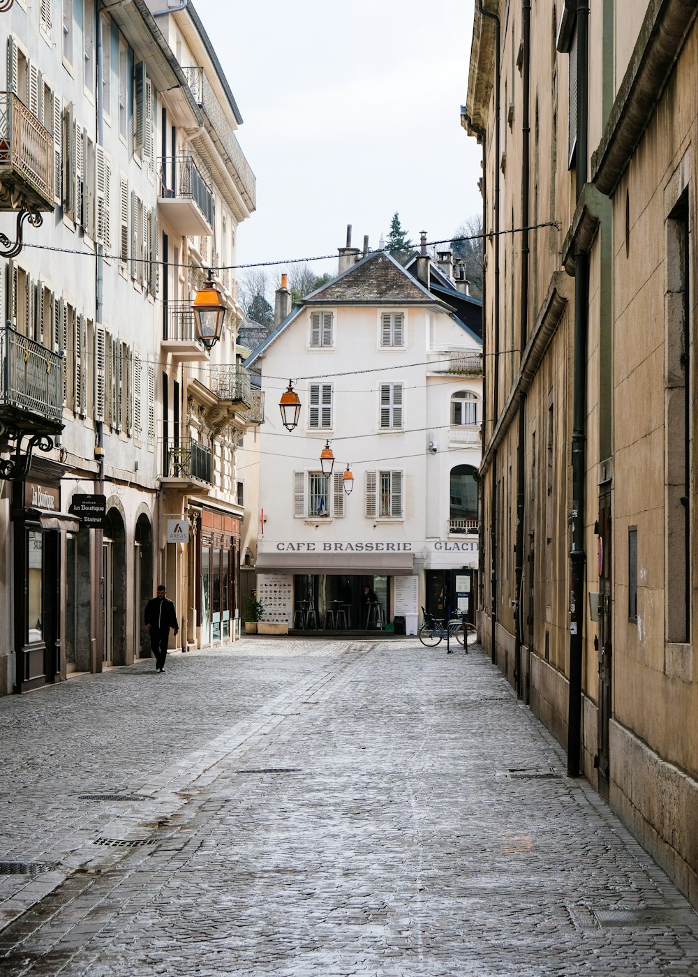 a cobblestone street in a european city