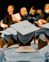 a group of people in graduation caps and gowns