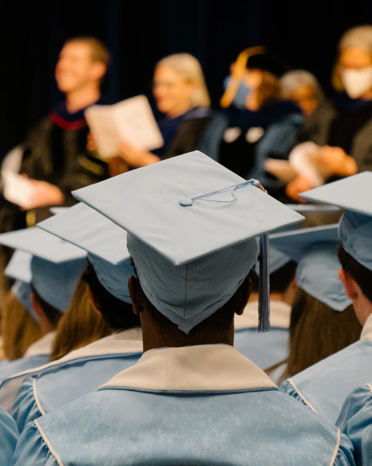 Graduating students in caps and gowns at a UK university ceremony