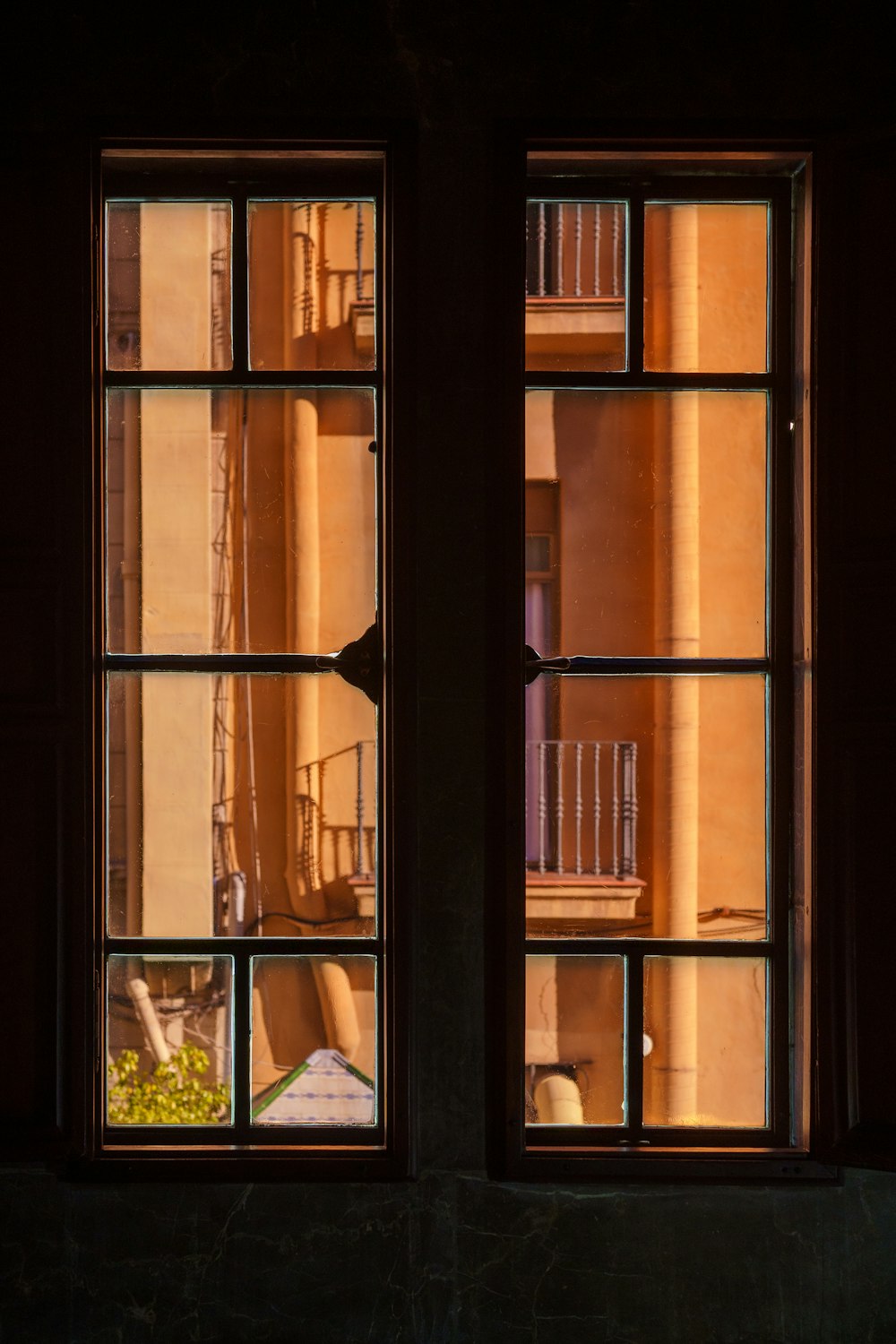 a couple of windows that are open in a building