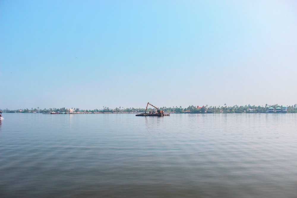 a boat in the middle of a large body of water