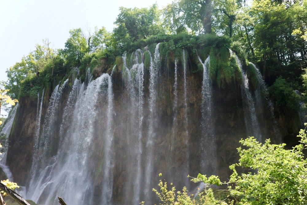 a very tall waterfall with lots of water