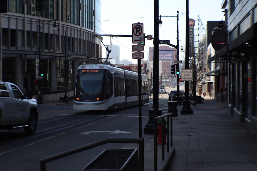 a city street with a train on the tracks