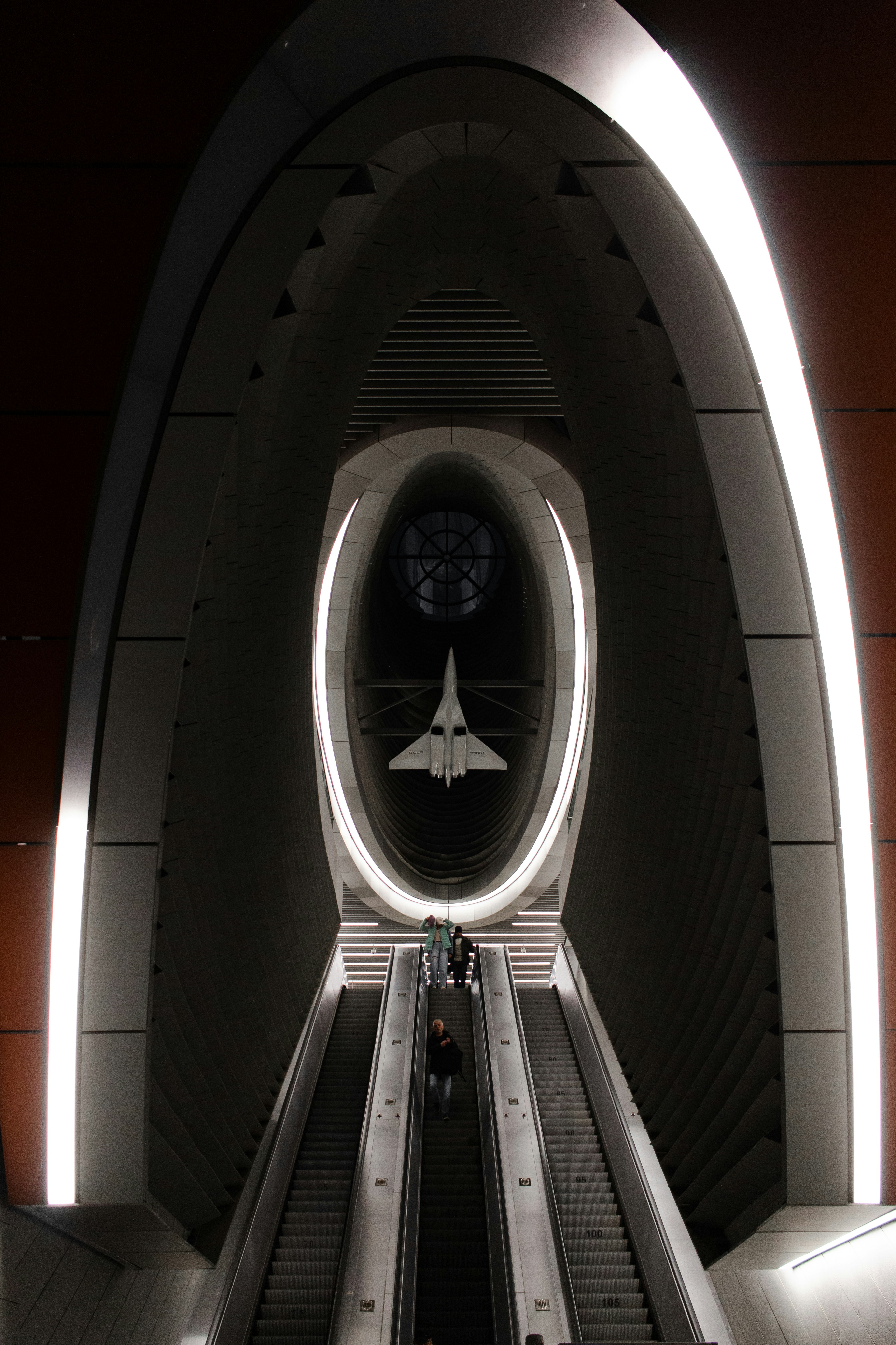 A cartoon illustration of a child in a spaceship looking at planets.