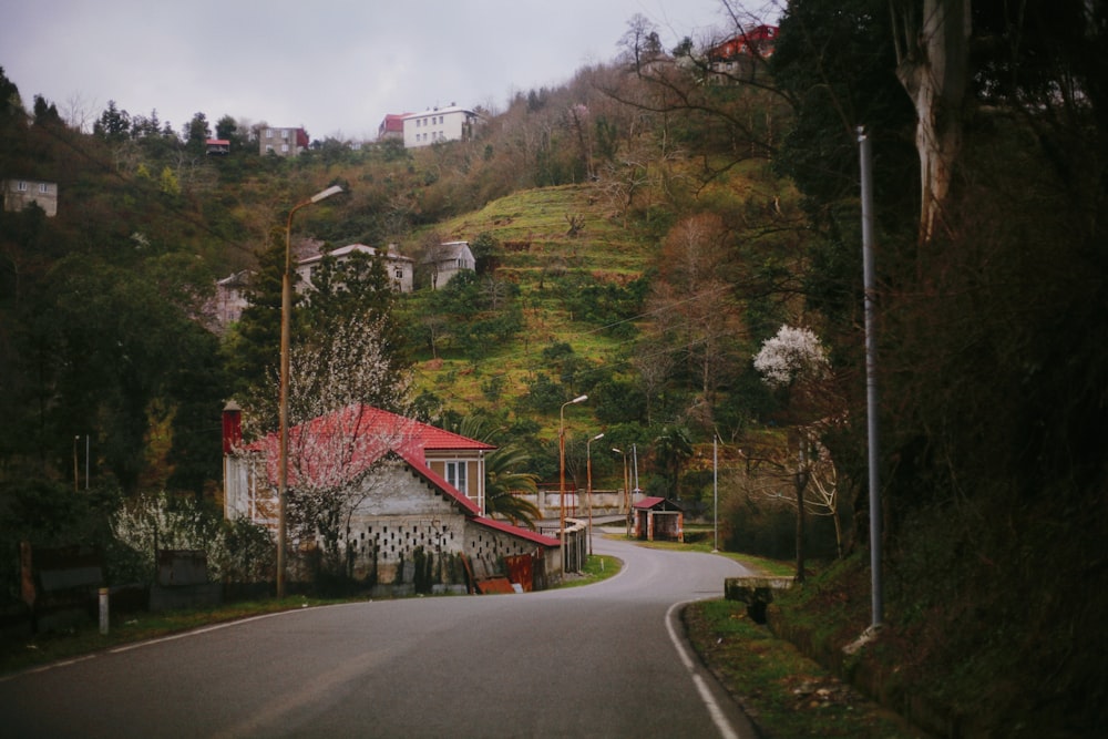 a road with a house on the side of it