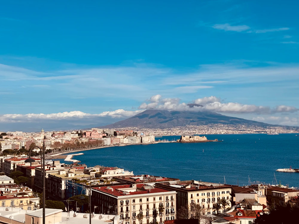 Vesuvius rising over the Bay of Naples and the historic city centre on an Italian school trip