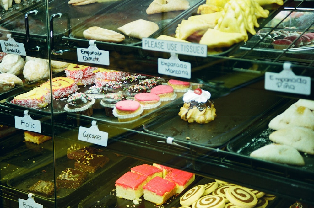 a display case filled with lots of different types of pastries