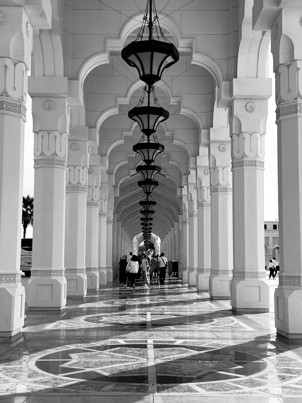 a black and white photo of a walkway