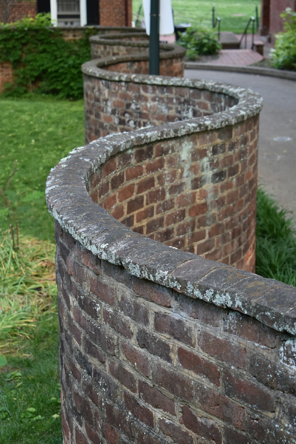 a brick wall with a clock on top of it