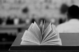 an open book sitting on top of a table