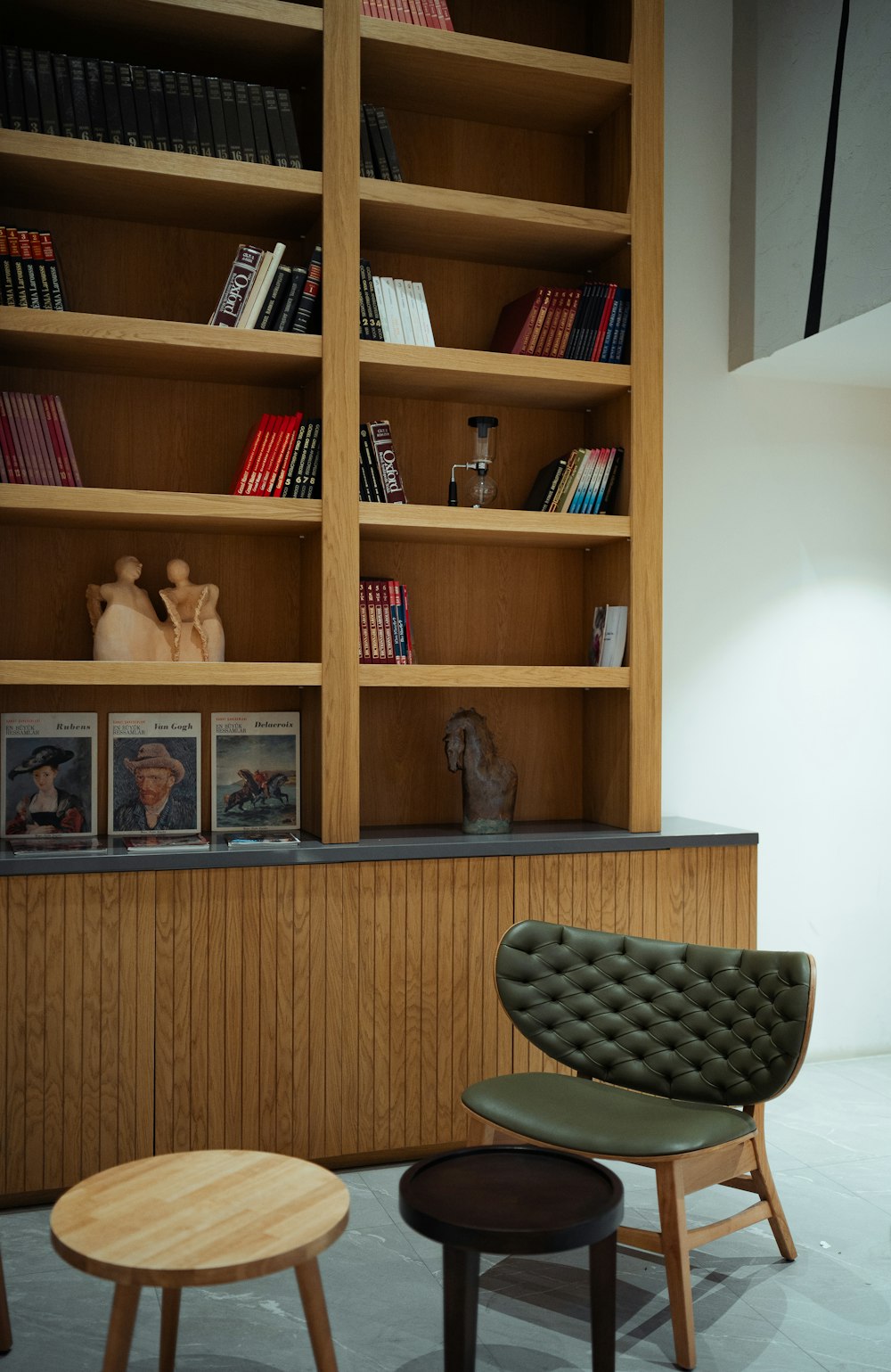 a chair and table in a room with bookshelves