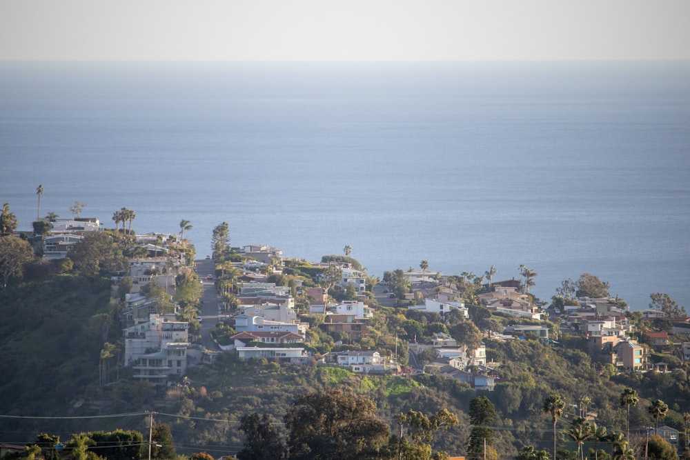 a view of a city on a hill overlooking the ocean