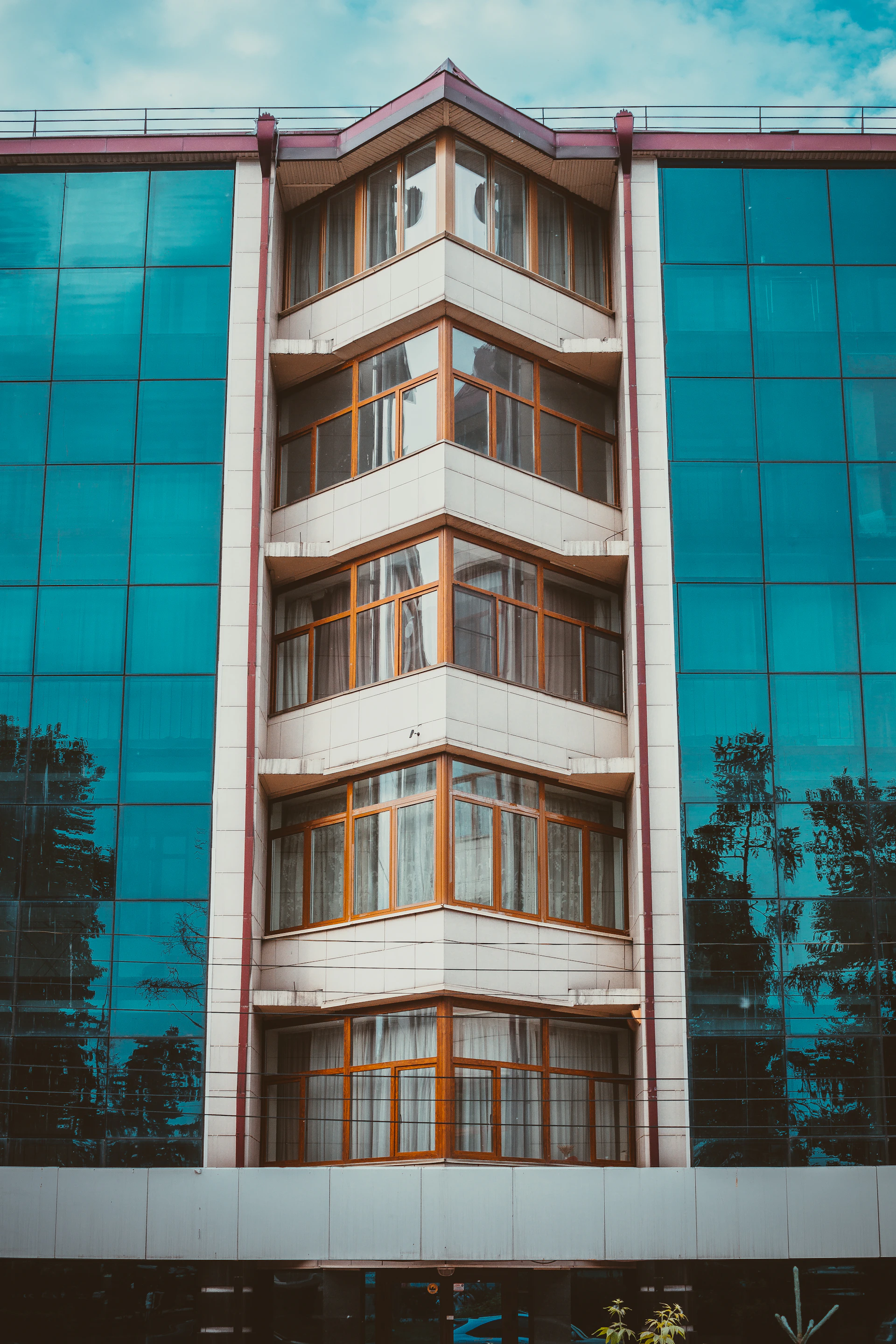 a tall building with a clock on the side of it