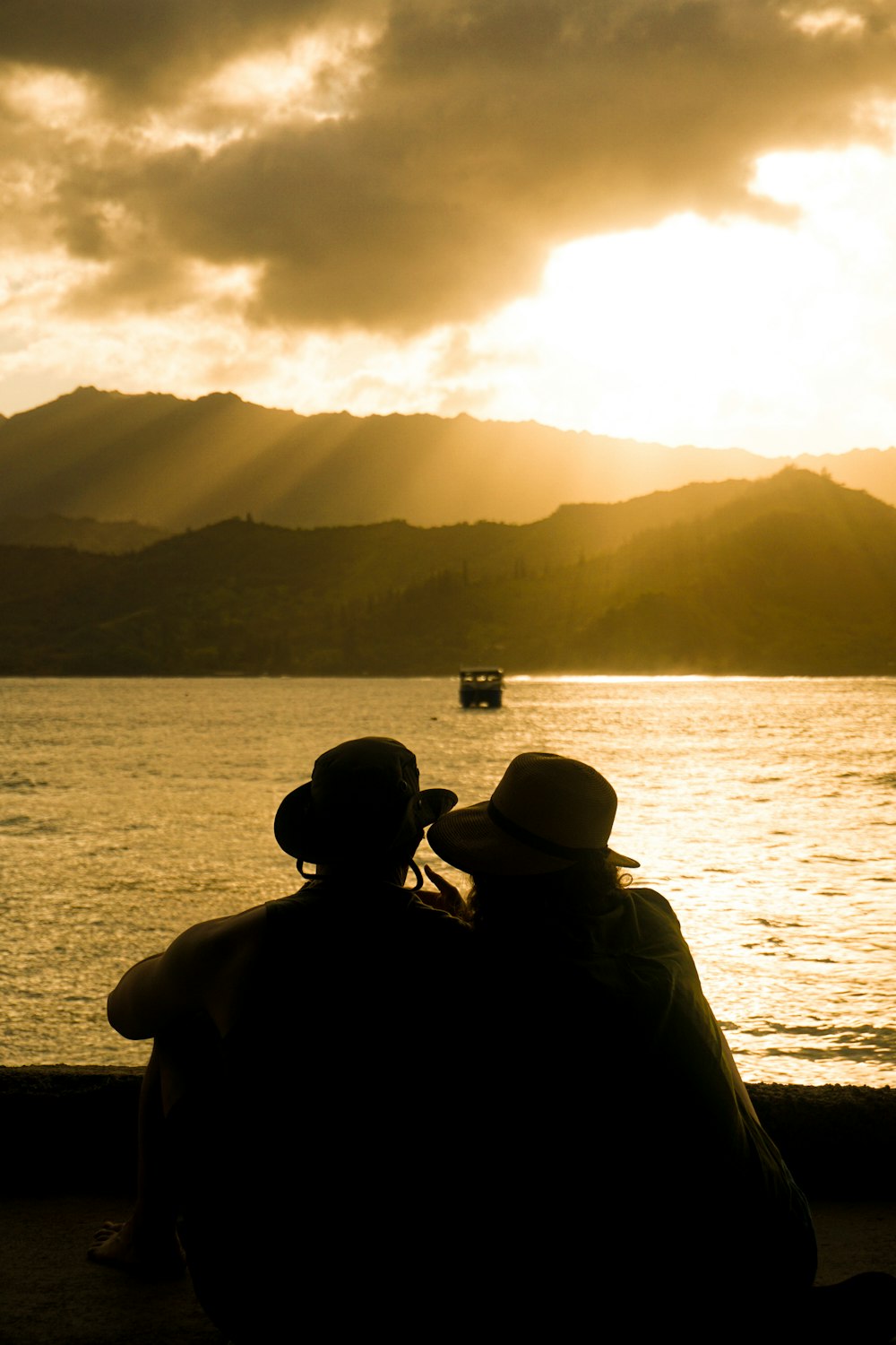 a couple of people that are sitting on a bench