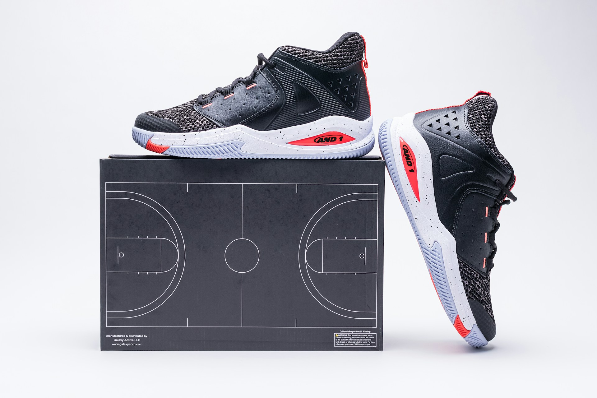 a pair of shoes sitting on top of a basketball court