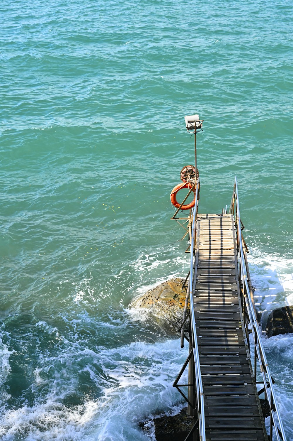 a dock with a life preserver and a life preserver on it