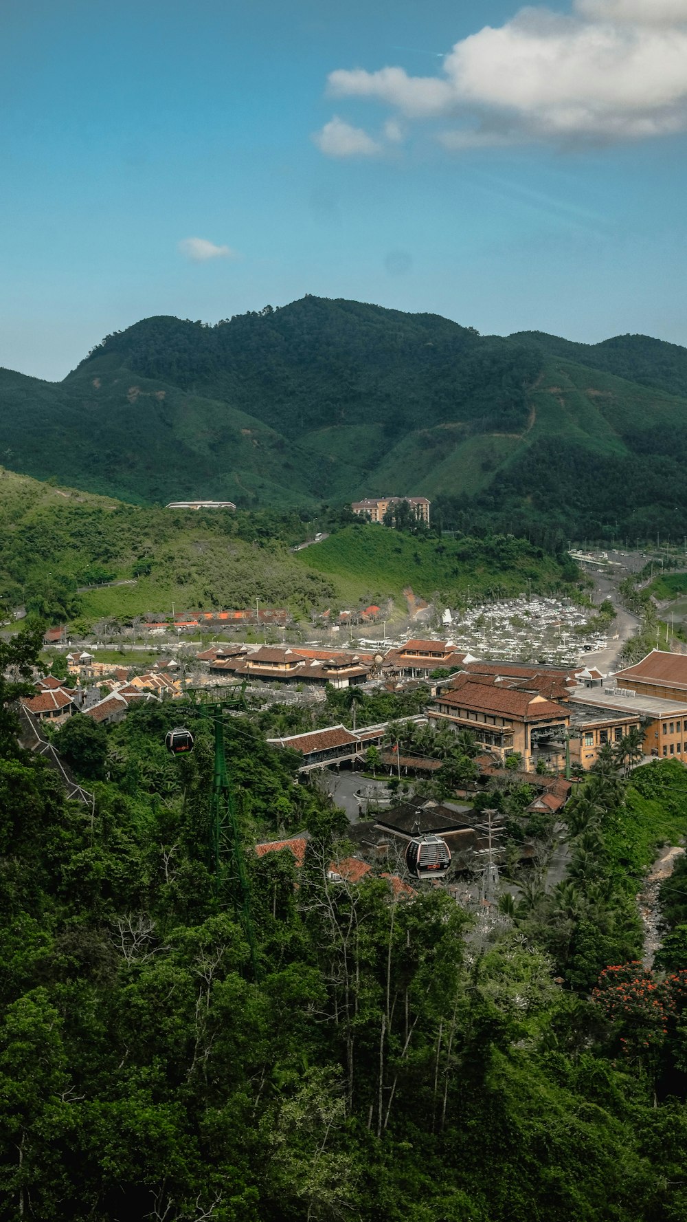 a scenic view of a town surrounded by mountains