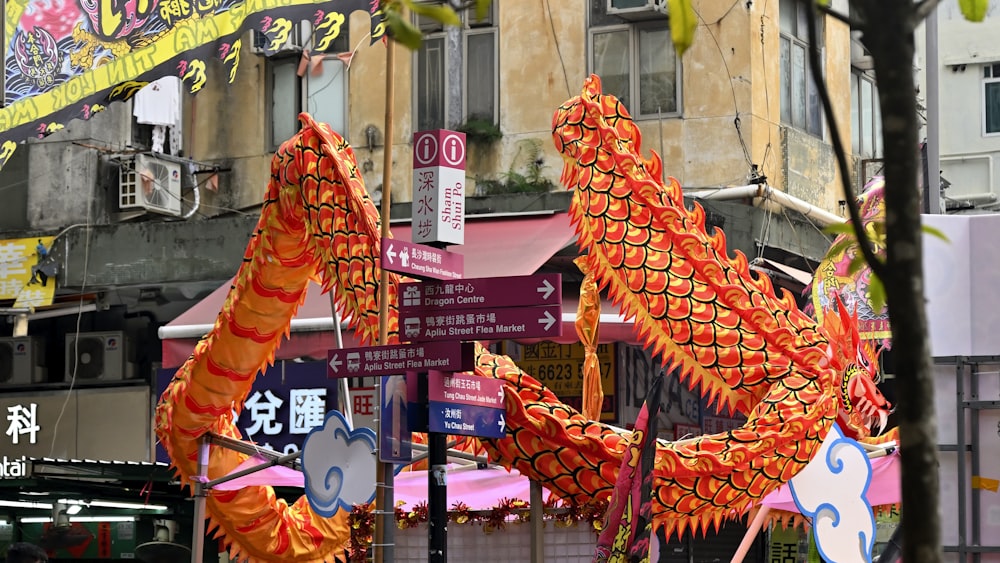 a dragon statue on the side of a street