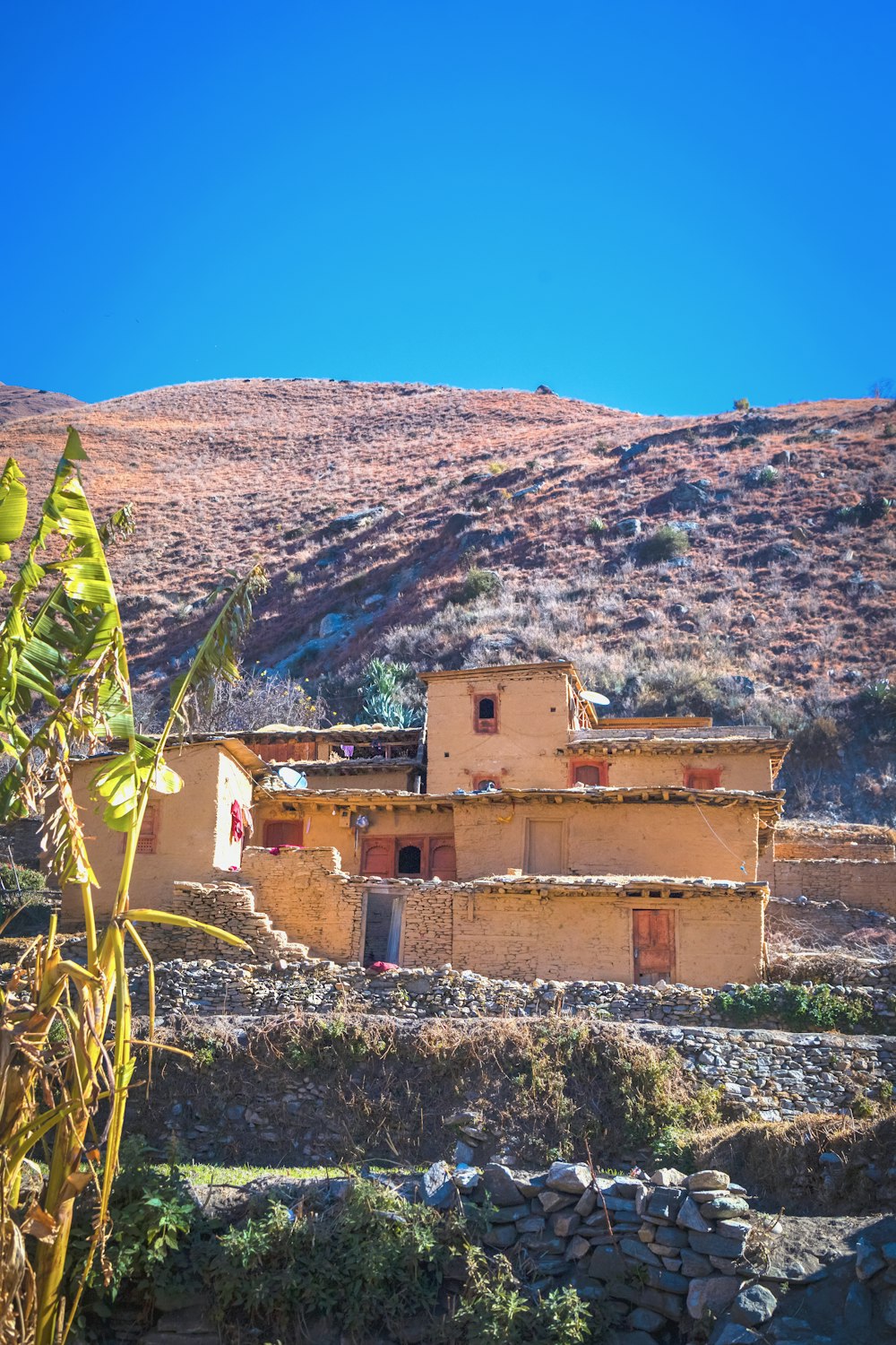 a house in the middle of a mountain