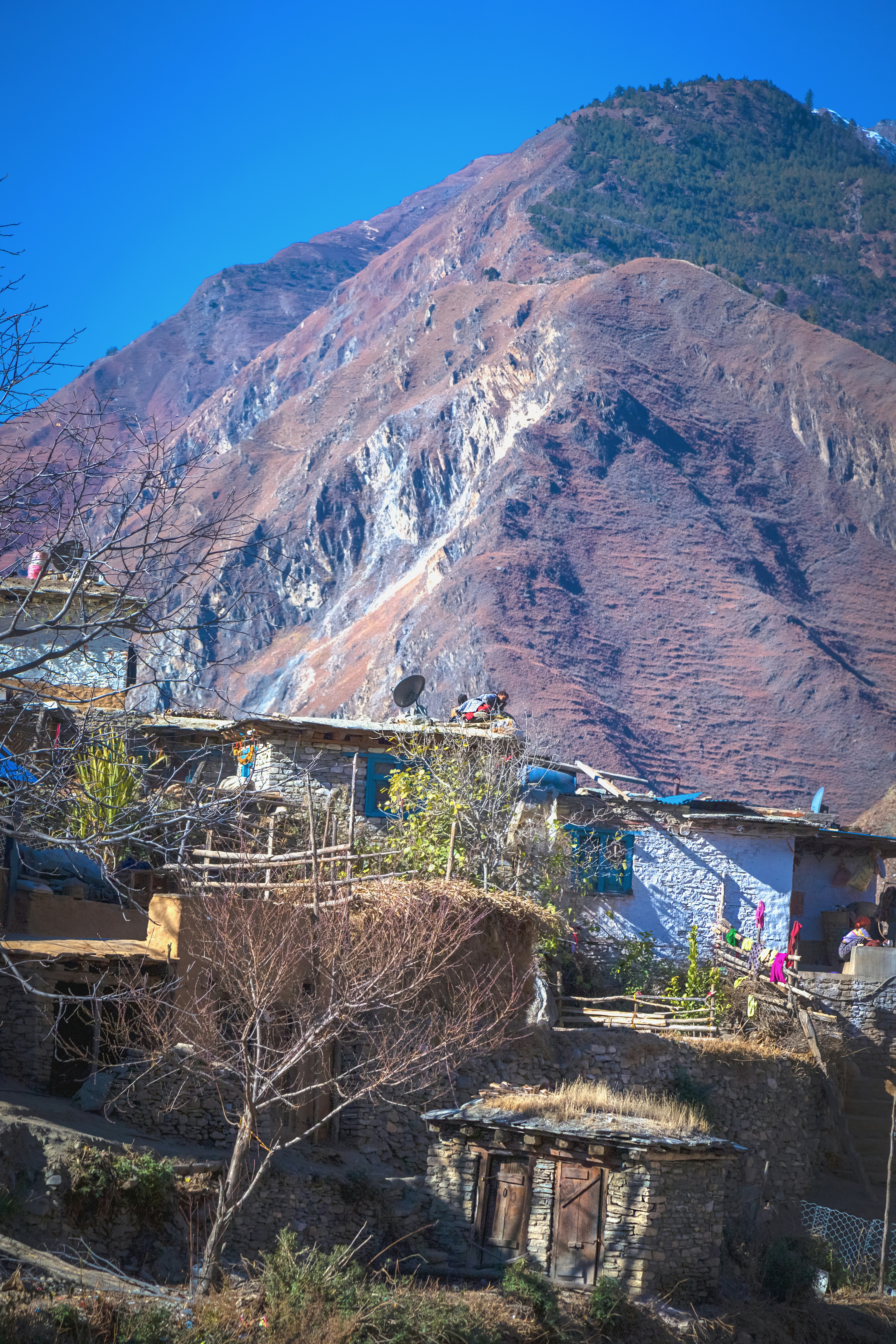 a view of a mountain with a house in the foreground