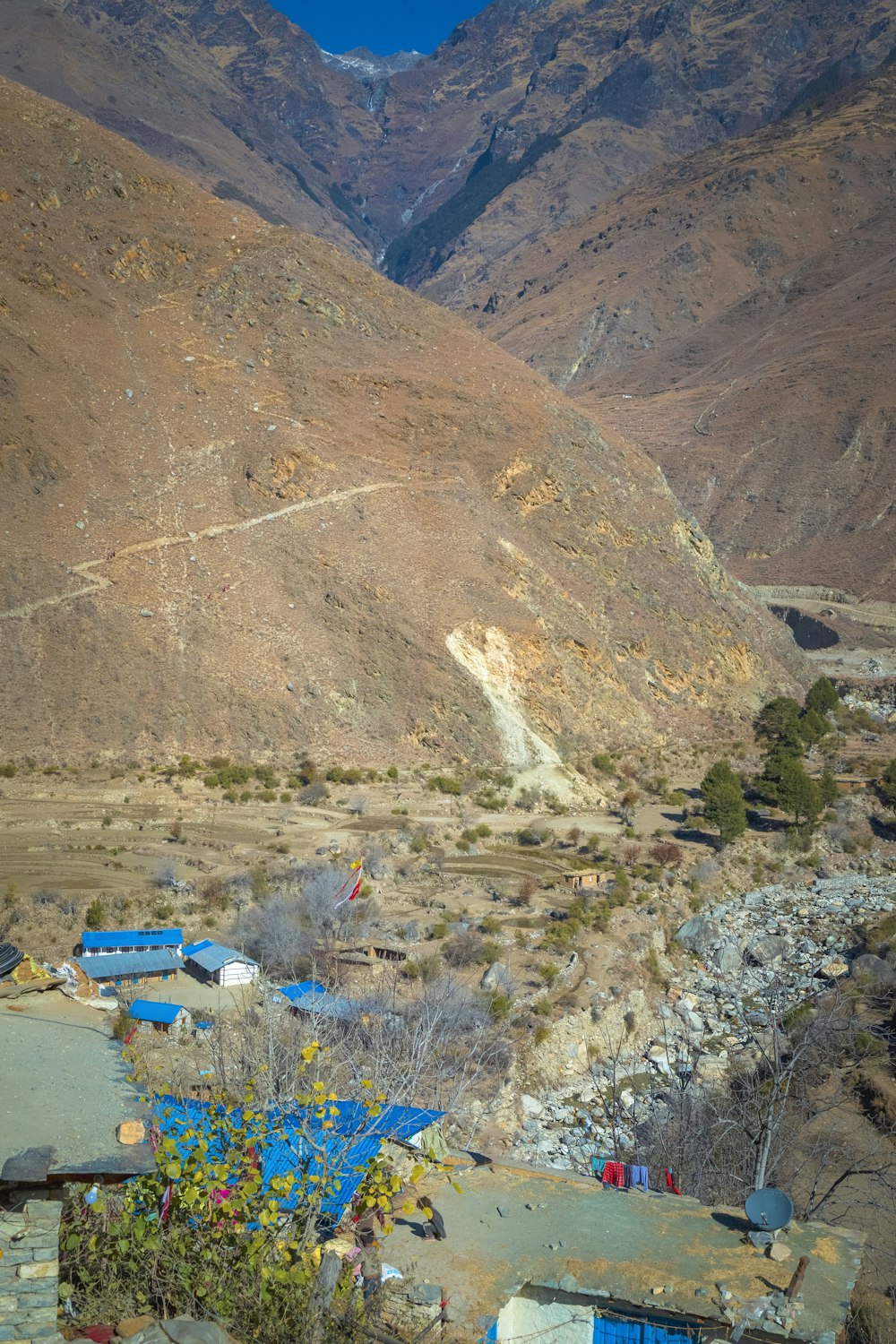 a view of a valley with mountains in the background