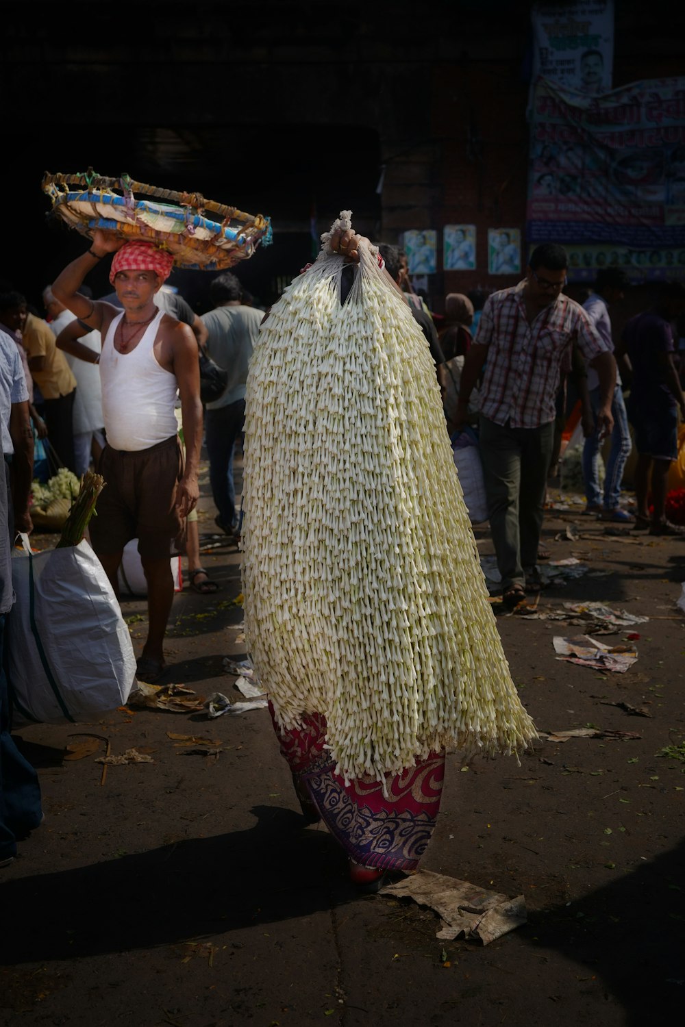 a woman carrying a basket on her head