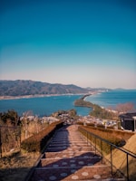 a view of the ocean from the top of a hill