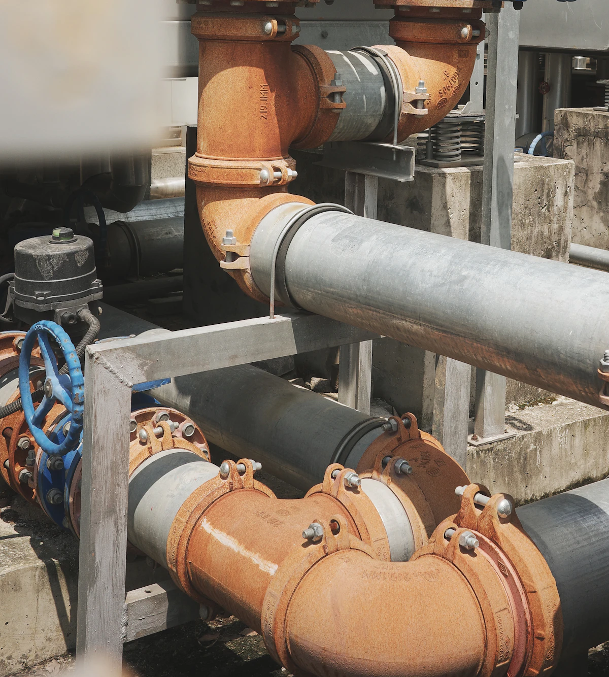 Industrial pipes and valve installations inside a processing facility