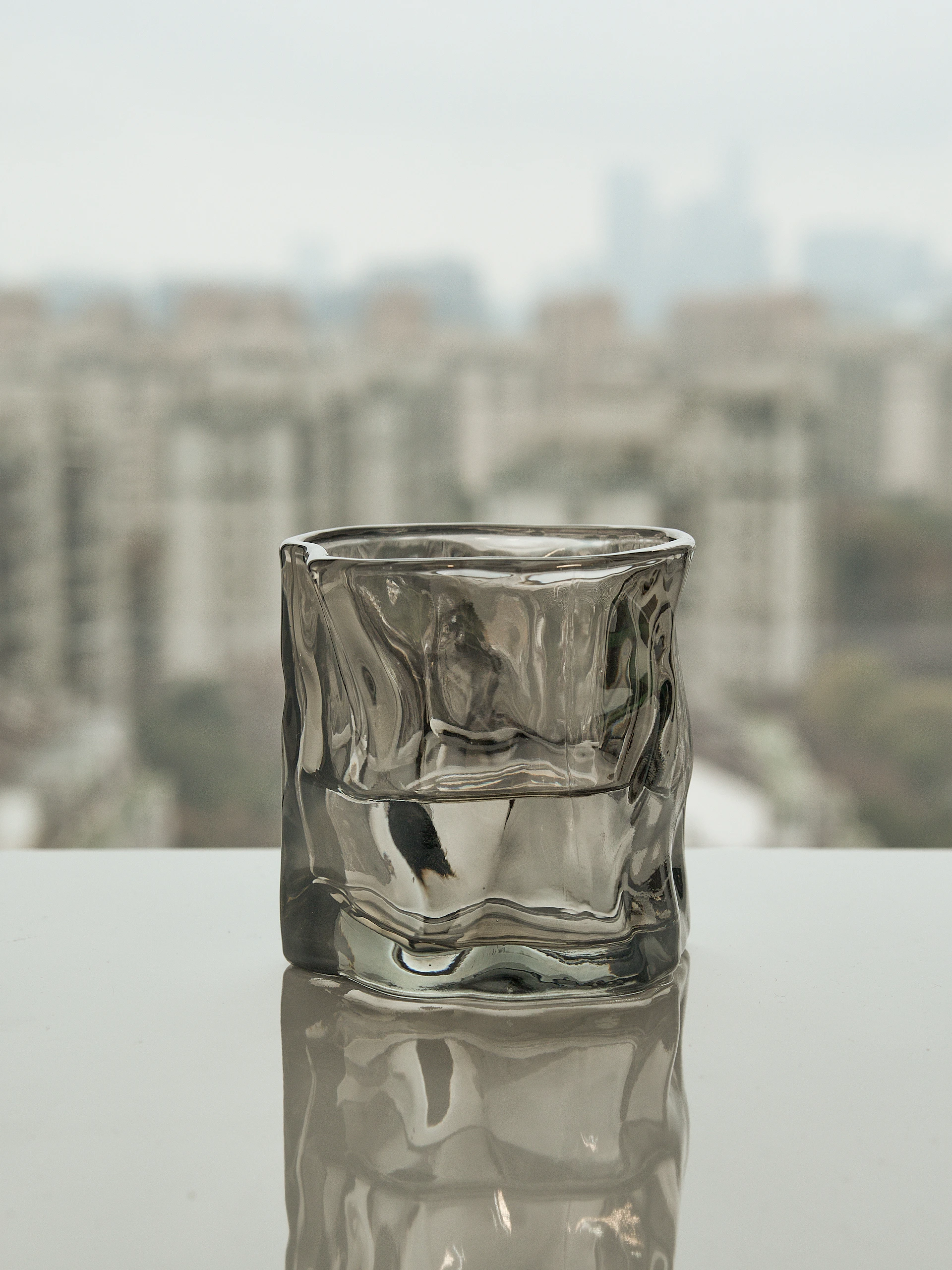 a glass of water sitting on top of a table