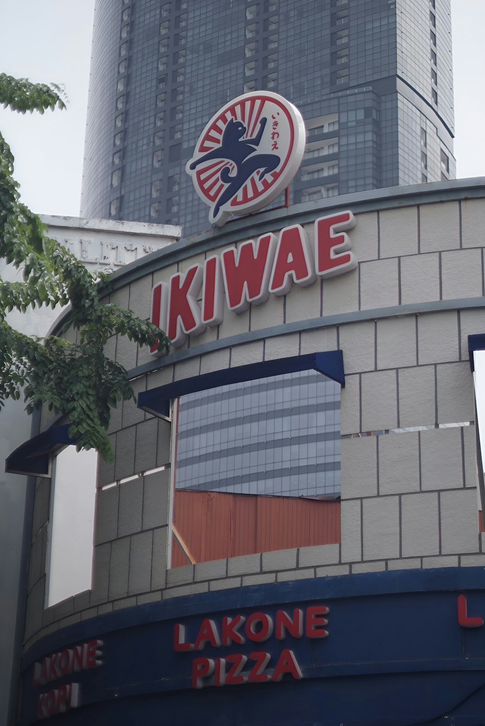a building with a sign that says kiwae above it