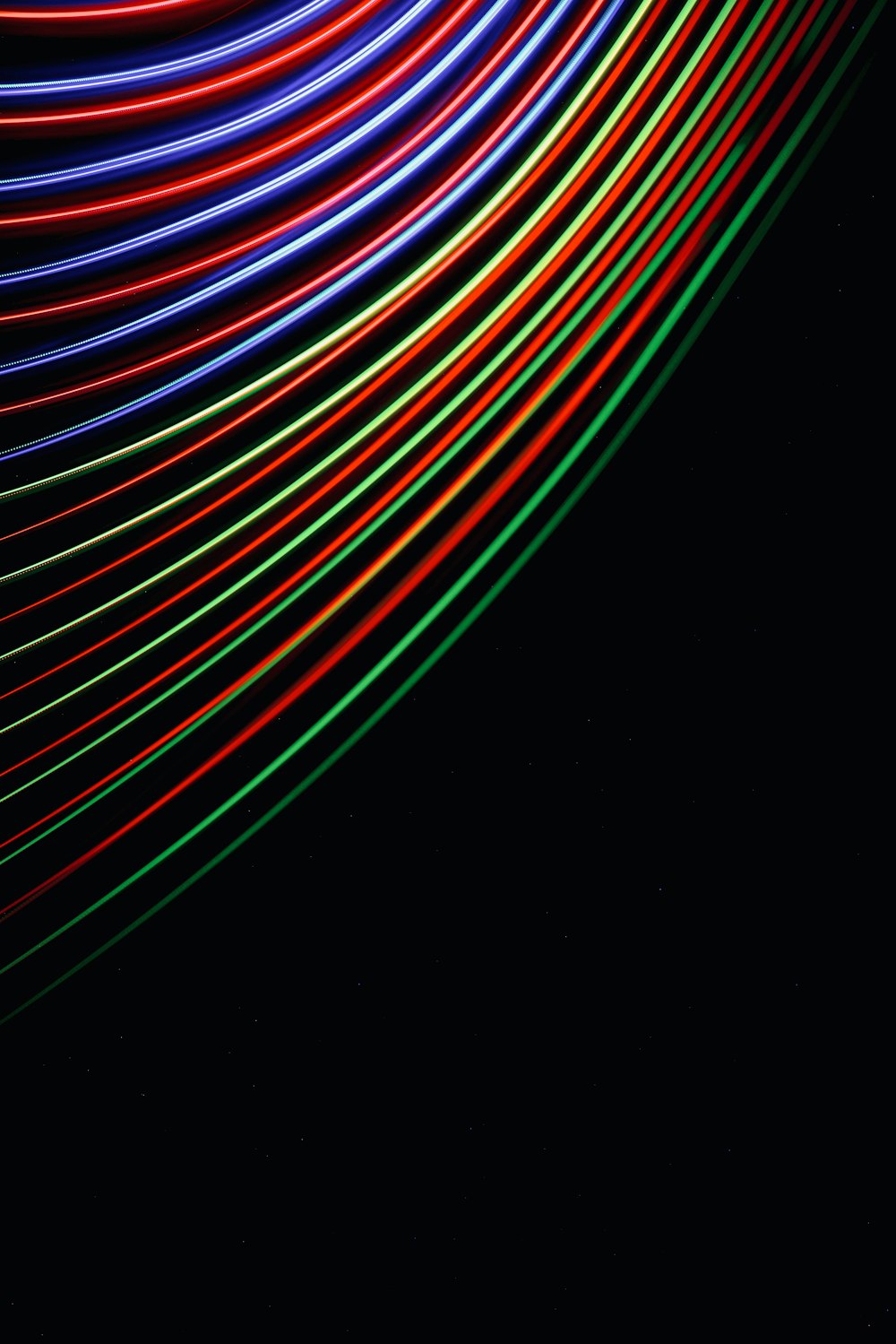 a black background with a multicolored pattern of lines