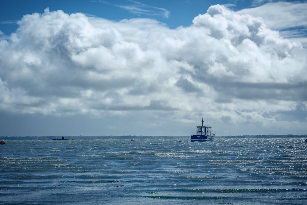 a boat floating on top of a large body of water