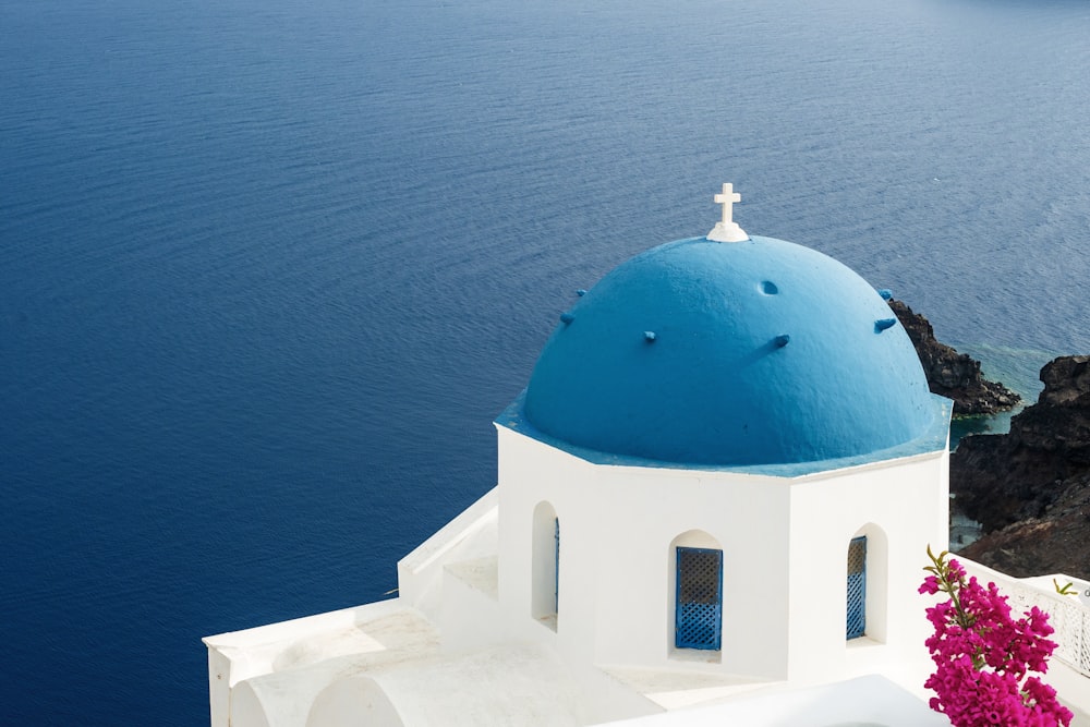 a white and blue building with a blue dome