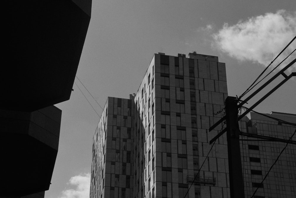 a black and white photo of tall buildings