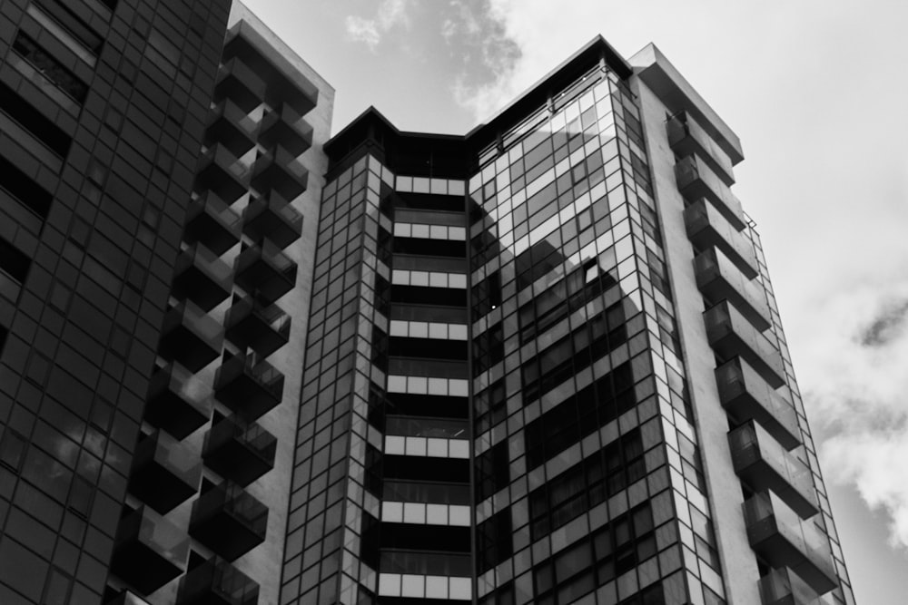 a black and white photo of two tall buildings