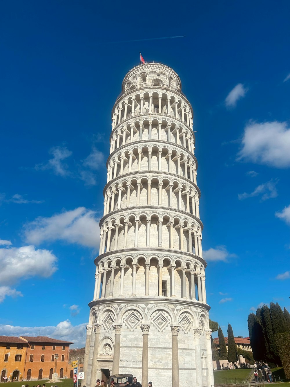 a tall white tower with a sky background