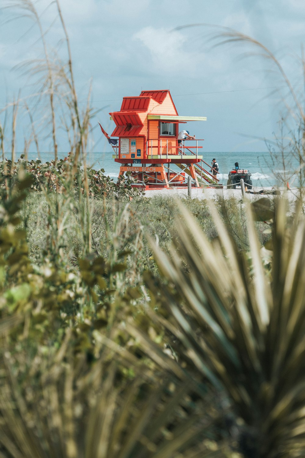 a lifeguard station on the beach with people on it